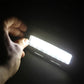 Glowing white LED vanity mirror light bars held in hand