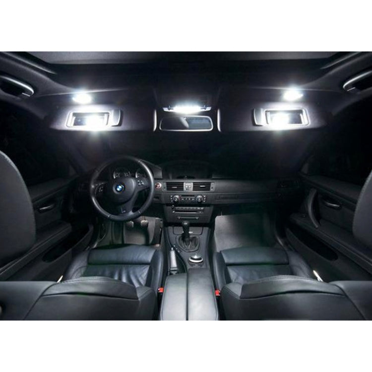 Car interior showing lit LED vanity mirror lights near the roof