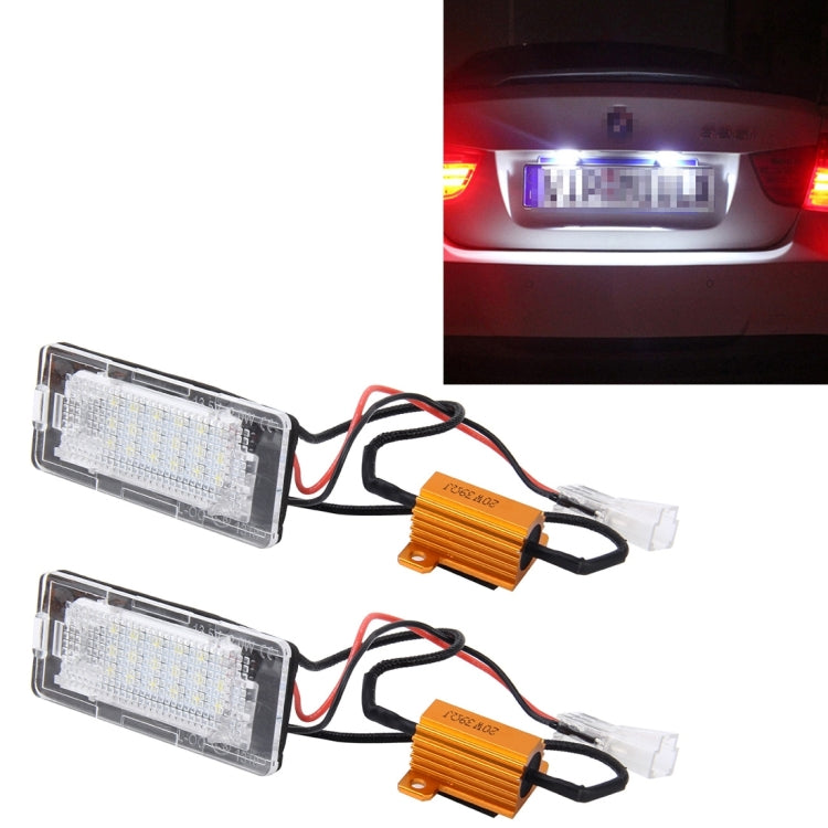License plate light kit with two clear housings, wiring leads, and two orange drivers