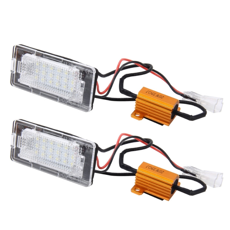 License plate light kit showing two LED lamp modules with clear covers, wires, and orange boxes