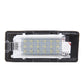 License plate light lens with embedded white LED chip array behind clear cover