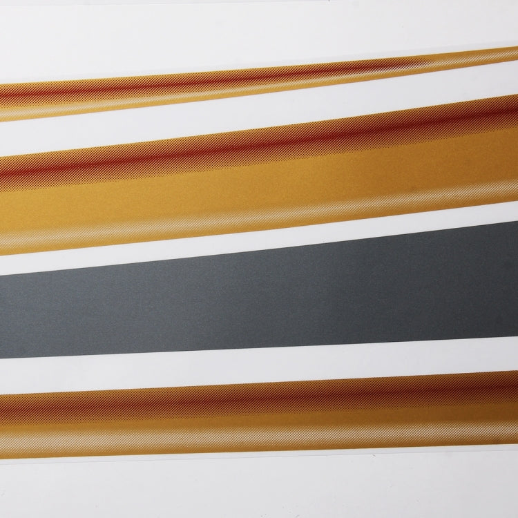 Close-up of gold metallic body strip sticker with fine mesh texture and dark underlayer