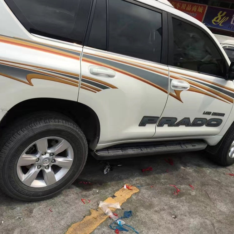 Gold-and-black decorative body strip decals applied along SUV side near wheel