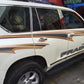 Applied gold-and-black angular side decals on white SUV door and quarter panel