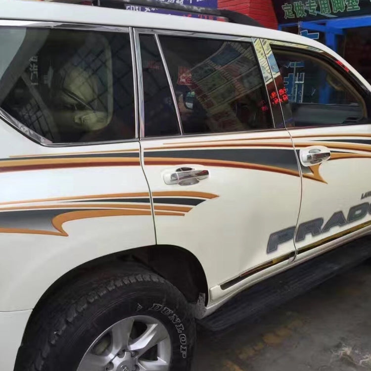 Applied gold-and-black angular side decals on white SUV door and quarter panel
