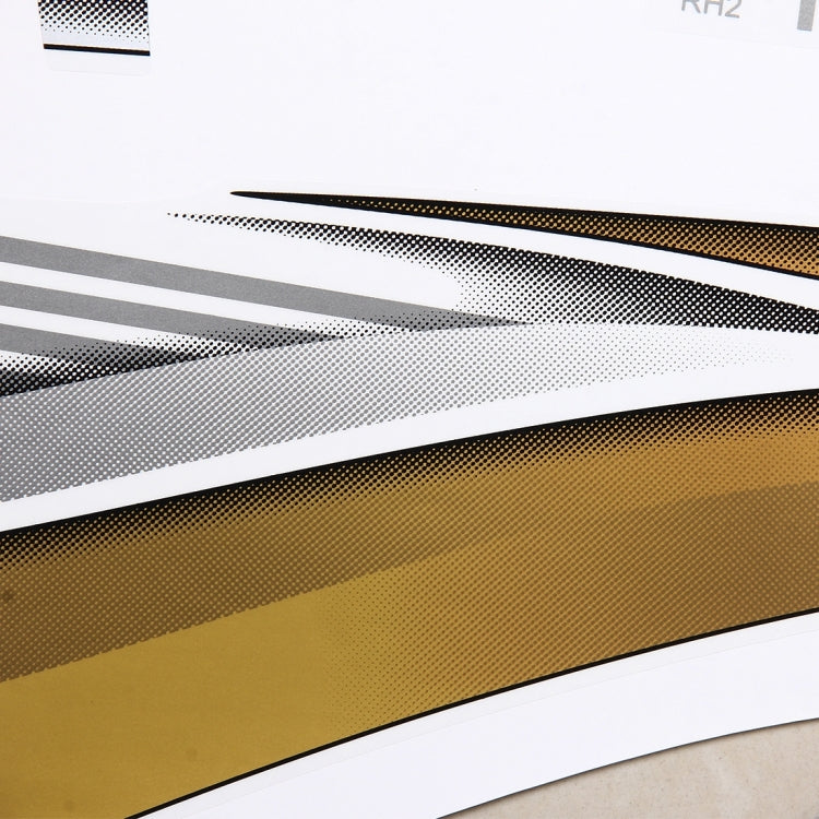 Metallic speckled gold and black decorative strip sticker with red accent line close-up