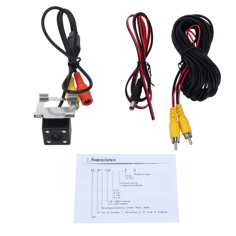 Backup camera kit with wiring harness, video and power leads, and instruction sheet