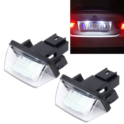 LED license plate light pair with black housing and clear lens, for Peugeot-style mounts