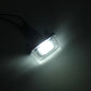 Single LED license plate light shining bright white through a clear rectangular lens