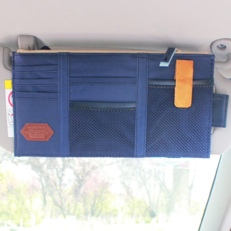 Dark blue car sun visor organizer mounted on car visor with sunglass pocket