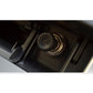 Car cigarette lighter socket with black cap in dashboard console