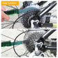 Green bicycle chain cleaning brush contacting rear cassette sprocket