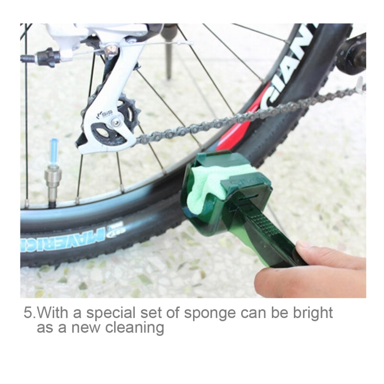 Green bicycle chain cleaning tool with blue bristle pad positioned on the wheel