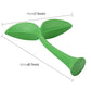 Green rubber decorative grass topper, two broad leaves, curved stem, foot base