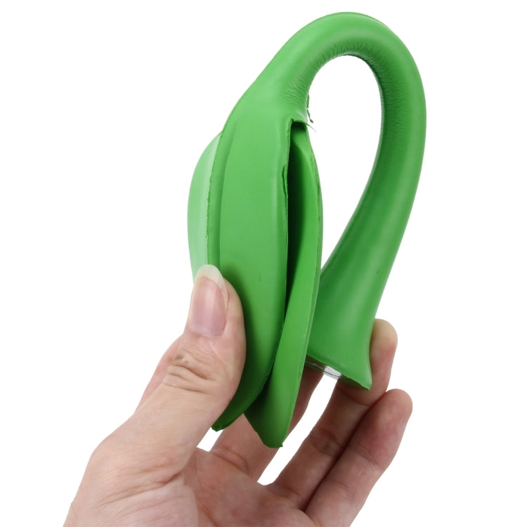 Green rubber decorative grass topper held by hand, tall arched leaf stem