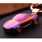 Metal car shape keychain holder with rainbow iridescent miniature car charm and metal ring.