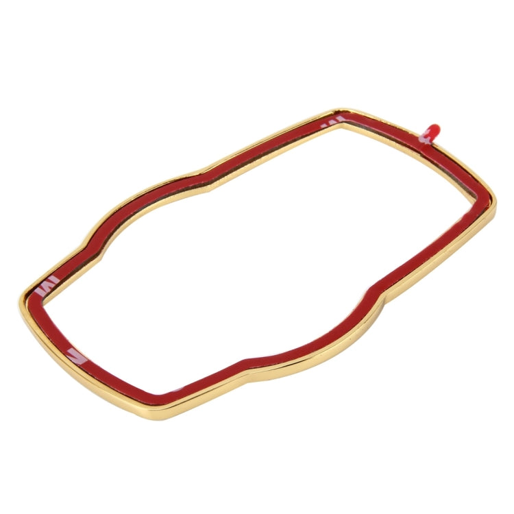 Gold-tone steering wheel decoration ring with red enamel center panel