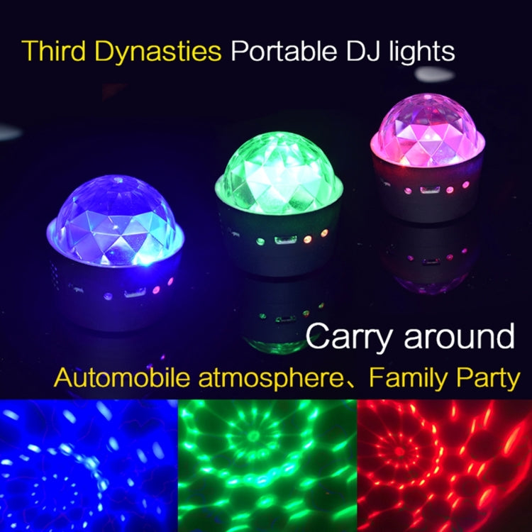 Portable DJ light glowing with blue, green, and purple rotating disco light effects