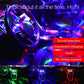 Portable DJ light casting colorful LED glow inside a car dashboard area