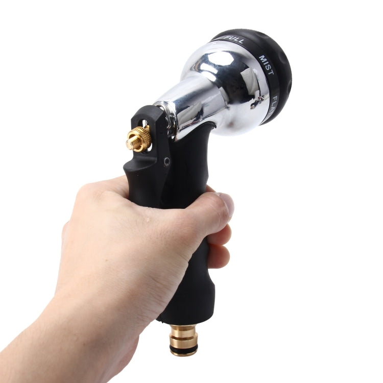 Handheld garden spray gun with chrome silver top, black grip, and brass water connector