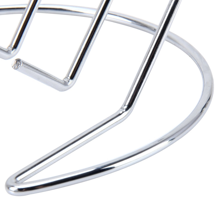 Chrome metal holder close-up showing curved base rail and vertical support bar