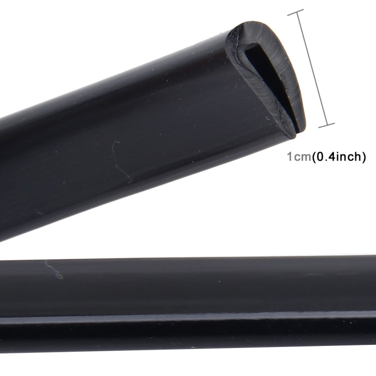 Black rubber door seal strip with profile edge opening, shown near 1 cm scale