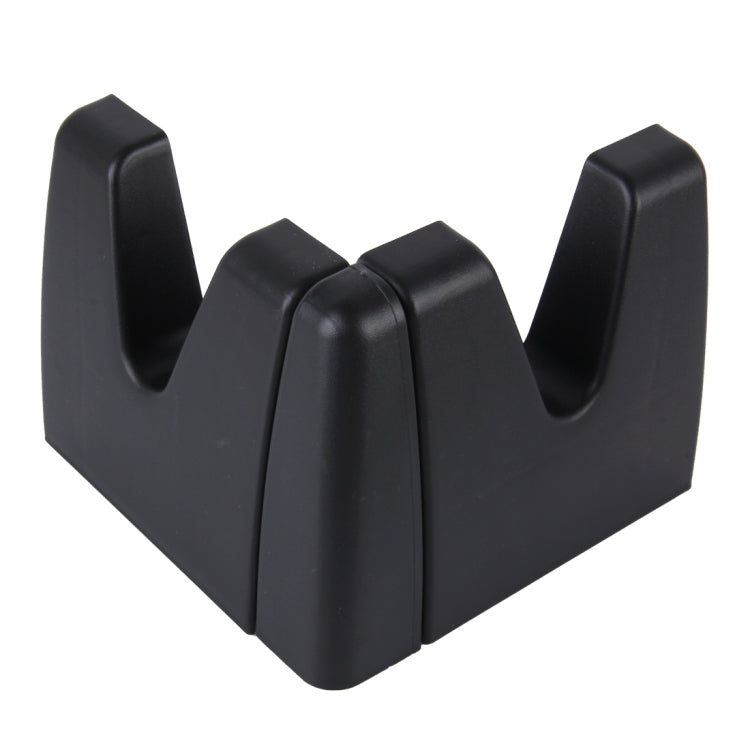 Black plastic vehicle storage holder with curved V-shaped prongs and center divider