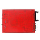 Red ECU programming PCB underside with circuit traces and ports
