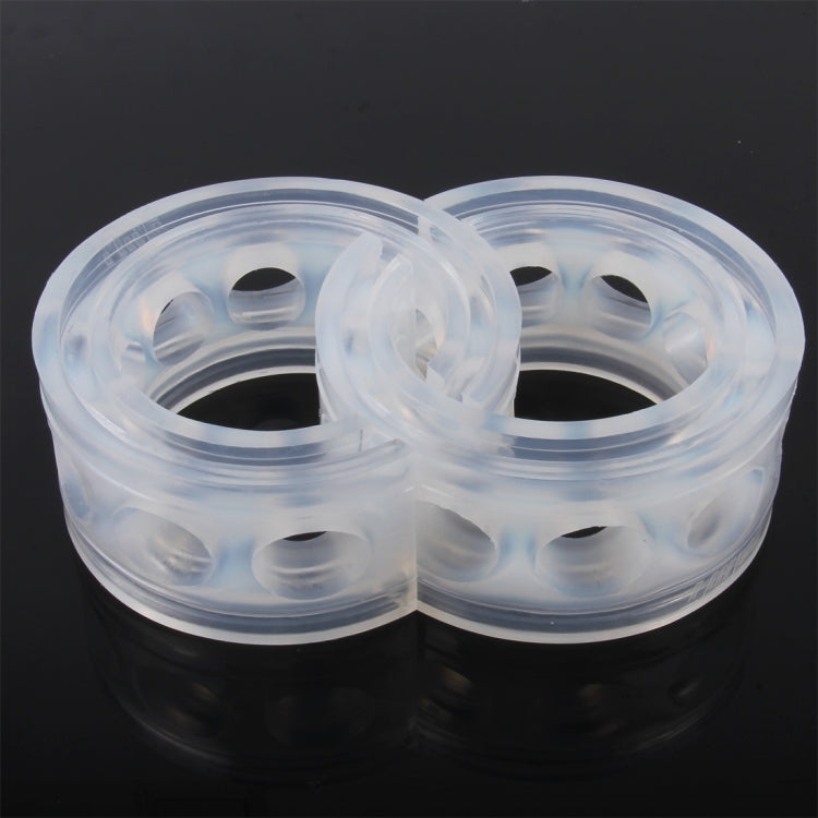 Pair of translucent shock absorber spring bumper buffer rings in close-up