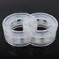 Two translucent shock absorber spring buffer rings with molded holes