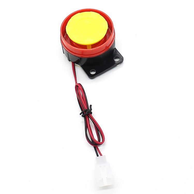 Red and black horn button with yellow top and wiring harness for motorcycle alarm