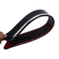 Black bumper guard strip with chrome-like trim, held by hand