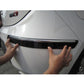 Black bumper guard strip being applied to car bumper lip