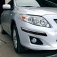 Black bumper guard strip on front bumper lip of a car