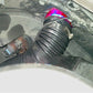 Universal air intake tube installed with black ribbed hose and purple-tinted coupler