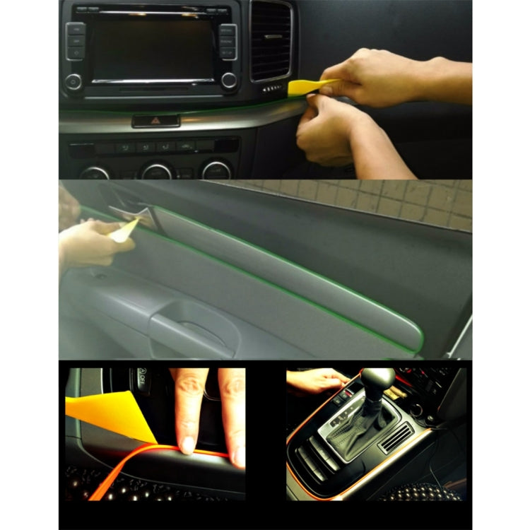 Car LED strip light glowing green along dashboard trim, flex strip installation
