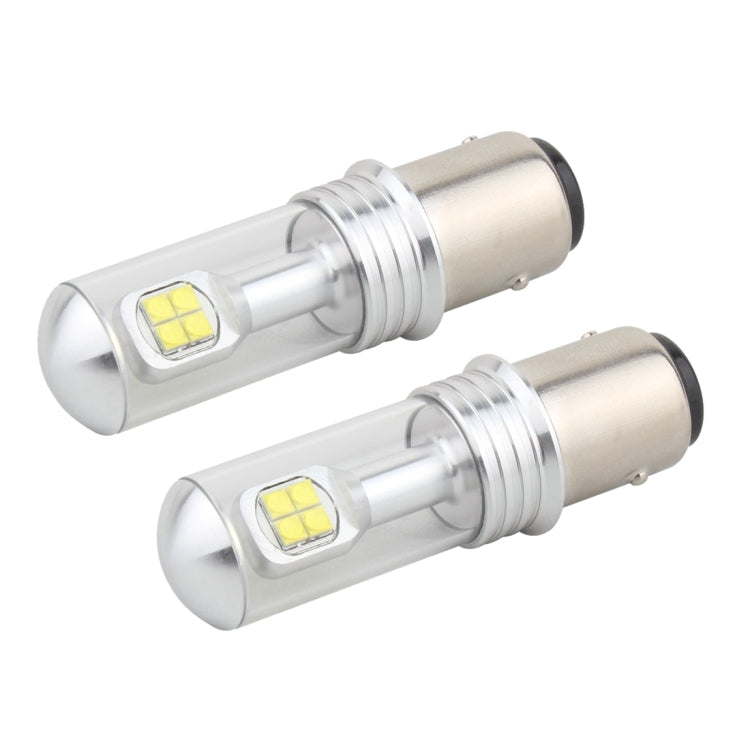 Pair of 1157 LED backup light bulbs with clear casing, visible yellow LED chips, metal base.