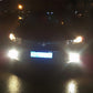 Car front with bright white fog lights on
