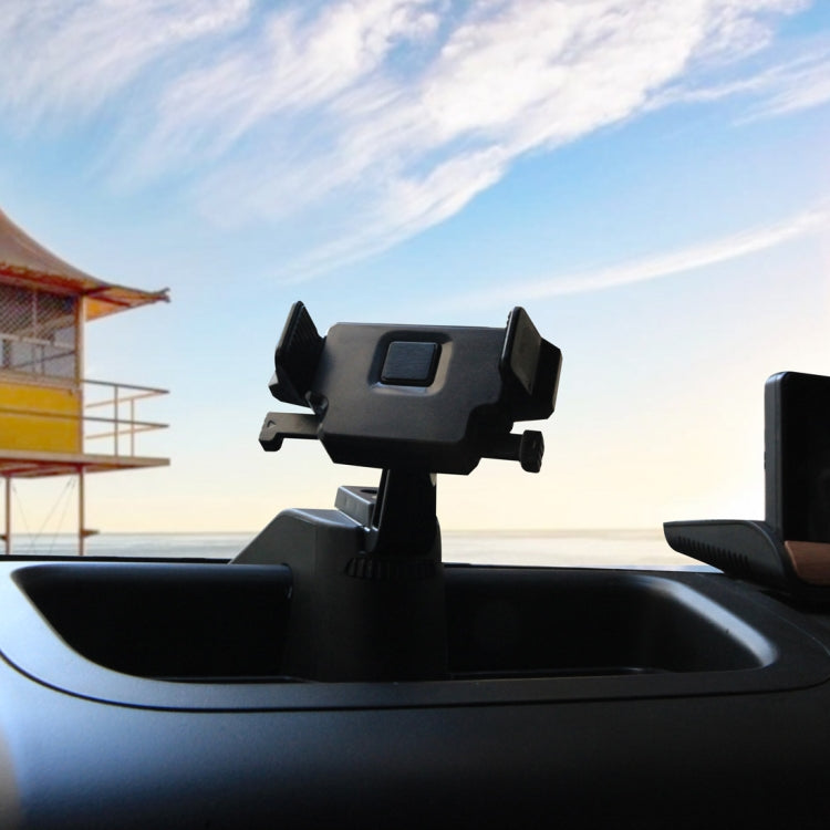 Black car GPS bracket mounted on dashboard with phone holder on top