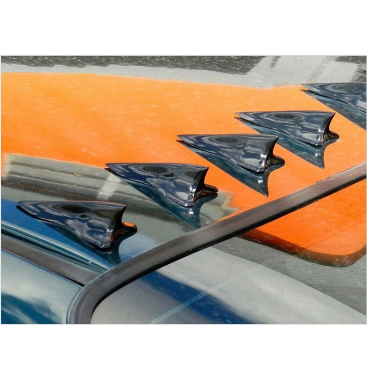 Black shark fin roof vortex diffusers installed on car roof