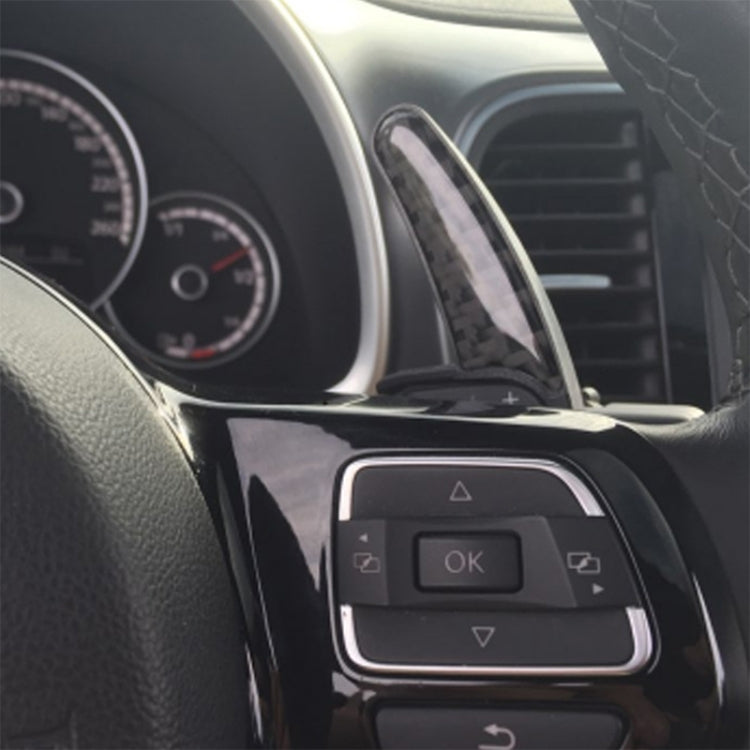 Installed black paddle shifters on steering wheel near control buttons