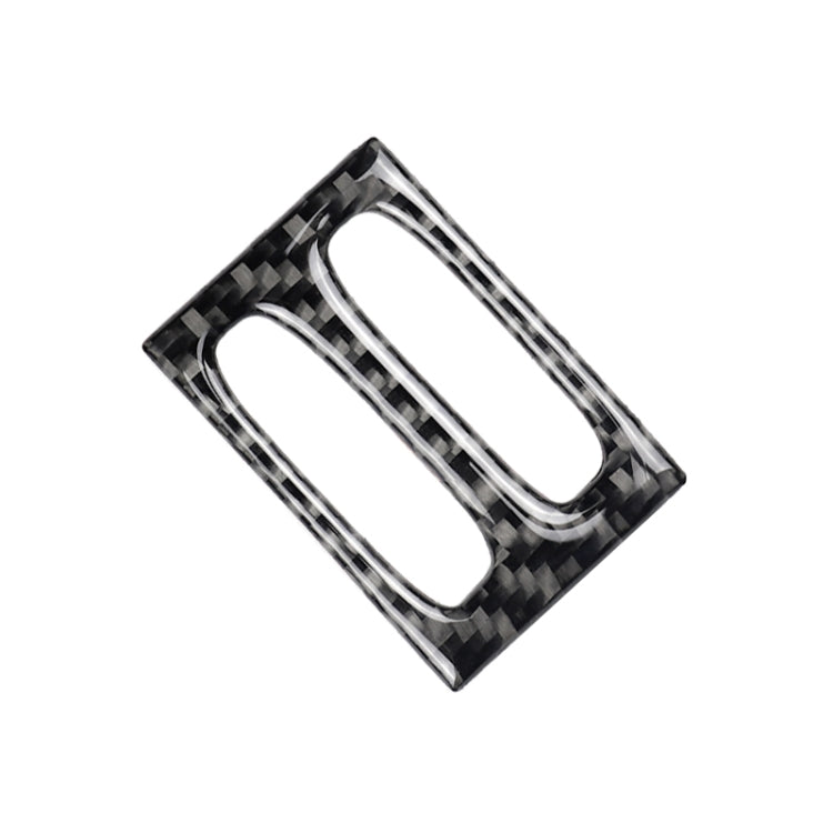 Carbon fiber decorative air outlet trim insert, angled view with two oval cutouts and chrome lines.