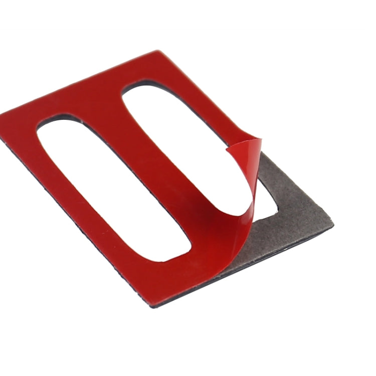 Red and black air outlet trim insert with two oval openings and glossy carbon fiber accents.