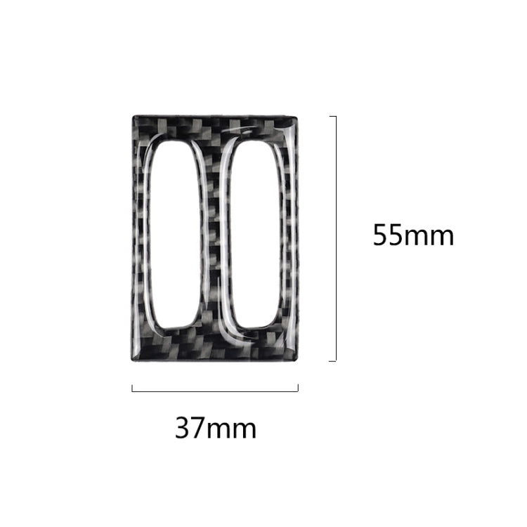 Carbon fiber air outlet trim insert with twin vertical oval cutouts and reflective chrome trim.