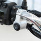 Headlight auxiliary switch with black 0/I button and silver clamp mount on handlebar