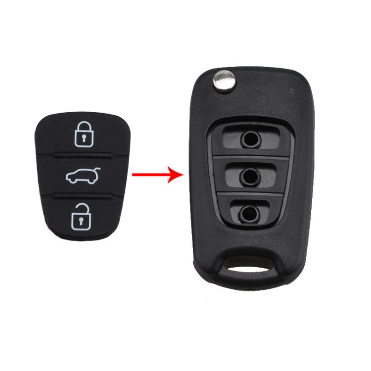 Black silicone key shell insert with three button contacts in a molded cavity