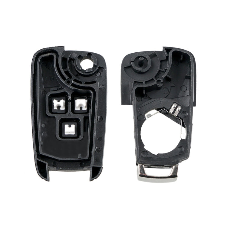 Inside view of black key fob case halves with button insert and metal contacts.