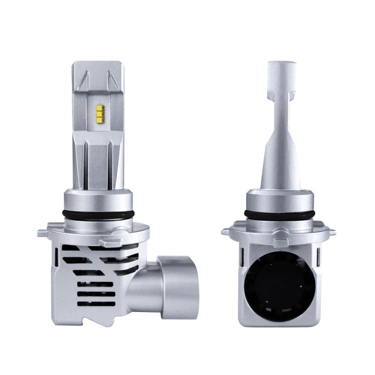 Pair of silver LED headlight bulb modules with cooling fins and a small yellow LED chip.
