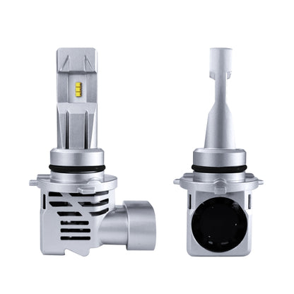 Pair of silver LED headlight bulb modules with cooling fins and a small yellow LED chip.