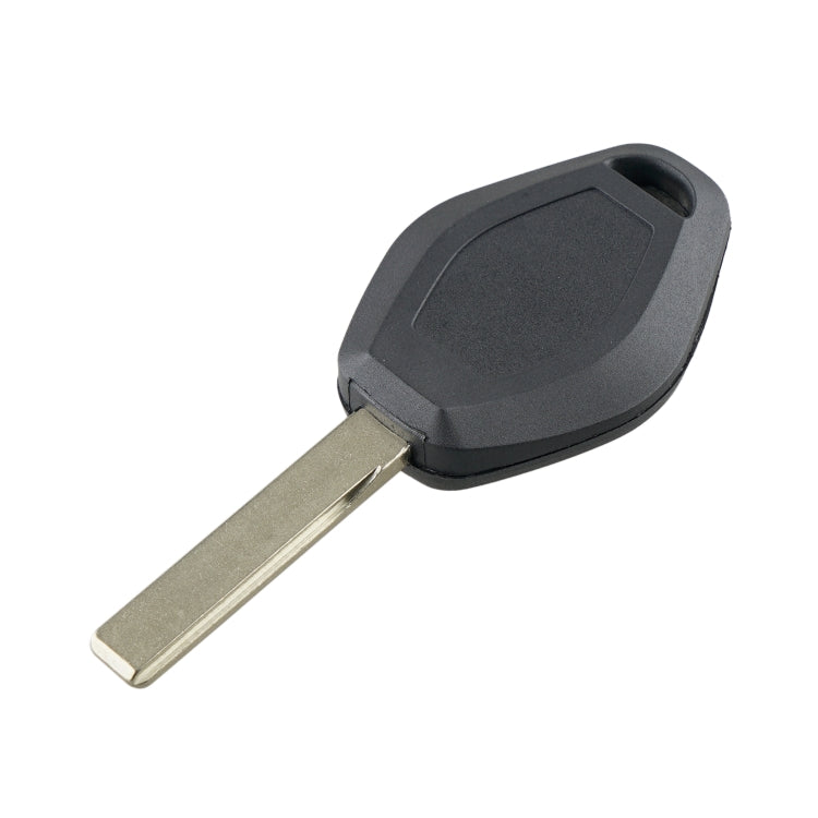 Black remote car key fob with metal blade, showing side profile and latch area.